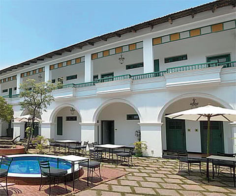 Cheerful interiors of Malabar House (left); the courtyard of the Grand Residencia (below)