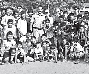 The trainees of the Sealine Santos Club’s summer coaching camp with ACP M Benoy and coach Rufus D’ Souza at the Parade Ground in Fort Kochi