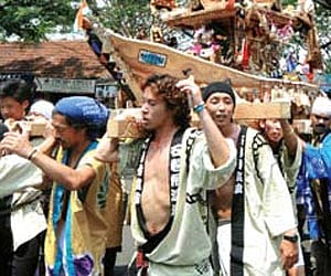 Japanese nationals carry ‘Mikoshi’, a portable shrine, through the streets of Mattancherry on Thursday | Express