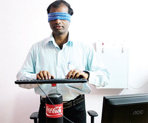 Goutham displaying his skills at typing blindfolded