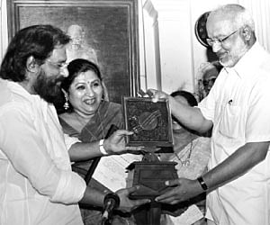 Cultural Affairs Minister M A Baby presenting the Swati Sangeetha Puraskaram to singer K J Yesudas at the Secretariat Durbar Hall on Tuesday | Express