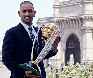 India's cricket team captain Mahendra Singh Dhoni poses with the ICC Cricket World Cup Trophy. (Getty Images)