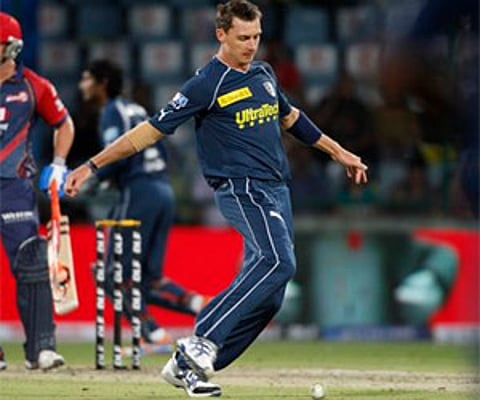 Deccan Chargers bowler Dale Steyn plays a bit of soccer with the ball on the pitch during an IPL cricket match (AP file photo)