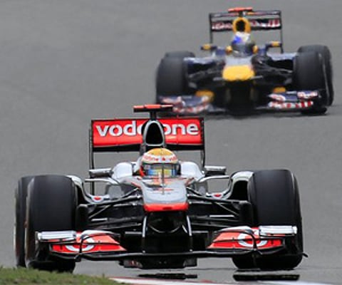 Force India driver Paul di Resta of Britain locks up his brakes during the third practice session for the Chinese F1 in Shanghai. (AP Photo)