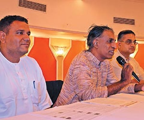 Project coordinator Shridhar Shyam Das and Ranga Krishna Das talking to the media about the ISKCON Radha Krishna temple. EPS