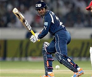 Deccan Chargers' captain Kumar Sangakkara walks back to the pavilion after his dismissal during the IPLt match against KKR in Kolkata, Monday. (AP)