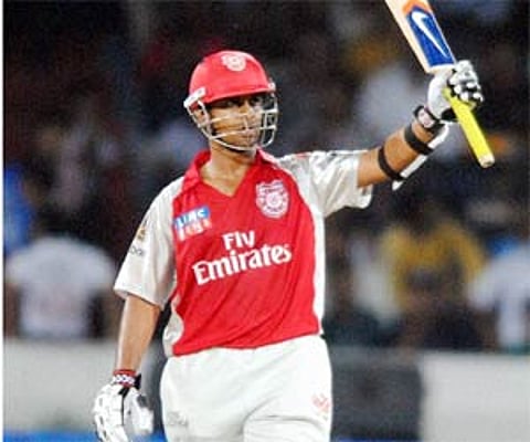 Kings XI Punjab player Paul Valthaty celebrates his half century during the match against Deccan Chargers in Hyderabad. PTI