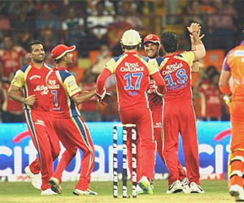 RCB’s Dirk Nannes and Zaheer Khan celebrate after taking the wicket of Kochi Tuskers Kerala’s Brendon McCullum in Kochi, April 9, 2011. (AP)