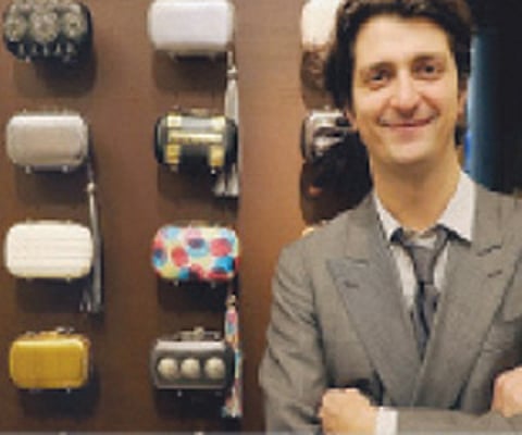 (Clockwise from above) Corto Moltedo with his offerings; the ‘Sunday Best’ bag; a Cassette Clutch in Nappa Blue, and a shimmering Sailing Shopper Beta