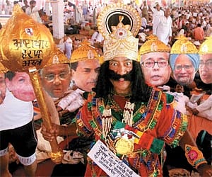 One of Baba Ramdev’s followers dressed as Ravan, with substitute faces of political leaders