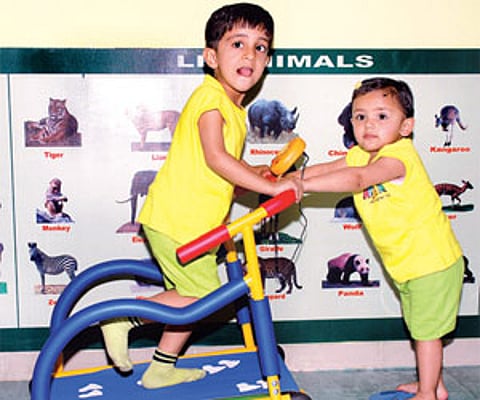A boy works on the treadmill; Weights are good too