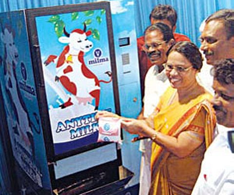 Mayor Mercy Williams inaugurating the Anytime Milk vending machine launched by Milma in Kochi by taking a packet of milk from the machine on Wednesday