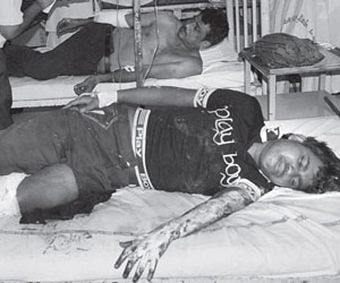 A priest blessing a devotee on the occasion of Maasi Magam at the Vaithikuppam near the beach on Friday in Puducherry | Photo EPS