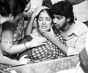 Actor Allari Naresh, son of film director E V V Satyanarayana who passed away on Friday, consoling his mother at their residence in Hyderabad on Satur