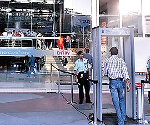 A customer entering through a metal detector at a shopping mall in Hyderabad| Express Photo.