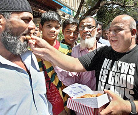 TRIUMPH OF JUSTICE: People celebrate with sweets after the Bombay HC upheld the death sentence awarded to 26/11 attack convict Ajmal Kasab, in Mumbai