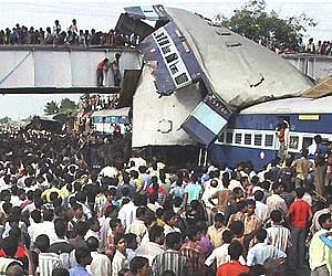 Rescue workers gather at the site of an accident at Sainthia station, about 200 kilometers north of Kolkata. AP Photo