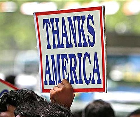 An Indian holds high a placard during a rally in support of the US operation that killed Bin Laden (AP Photo/Gurinder Osan).