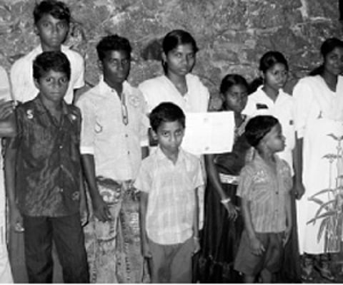 Some of the students of the Pozhimala colony in Pazhoor, Piravom