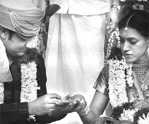 Olympic sprinter Chitra K Soman takes the wedding ring from Sachin Bal, at their marriage held at Mattakara, near Pala, on Sunday.