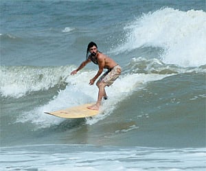 A surfer at Ramchandi in Orissa