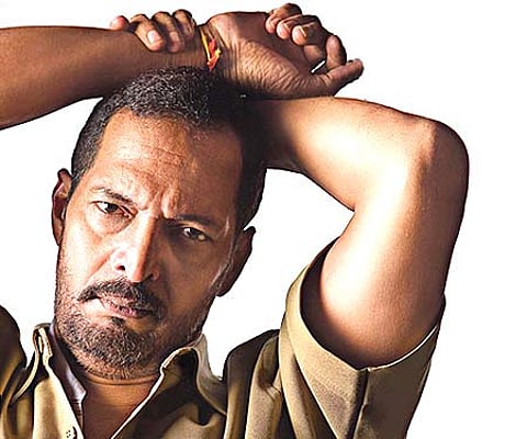 Nana Patekar from the poster of 'Taxi No 9211'.