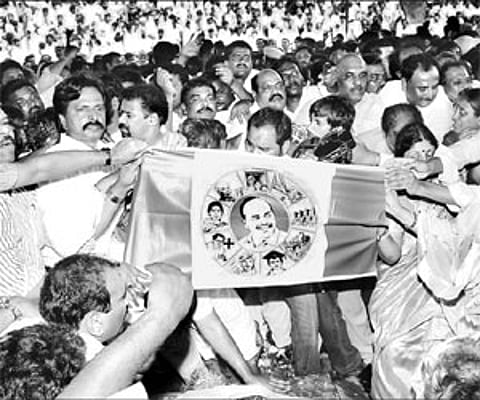 Y S Jaganmohan Reddy launching the YSR Congress Party flag amidst his supporters at Idupulapaya on Saturday (EPS).