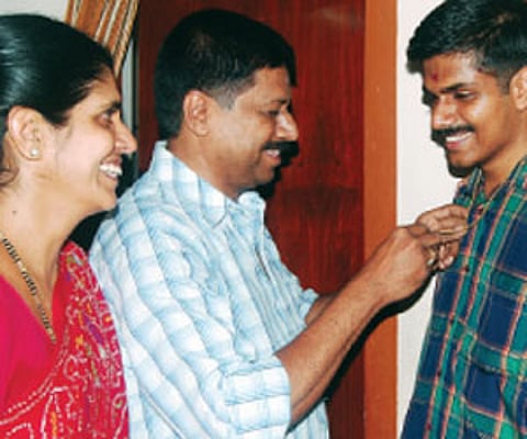 Abhiram being gifted a gold chain by his father Giri Shankar and mother Mini Shankar on Thursday|Express