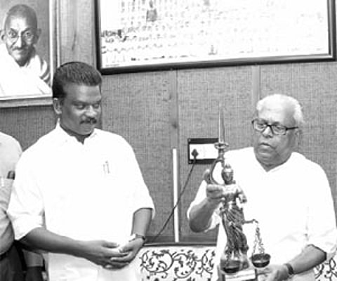 Chief Minister V S Achuthanandan handing over the statuette of Lady Justice to Speaker K Radhakrishnan in the city| Rajeev Prasad.