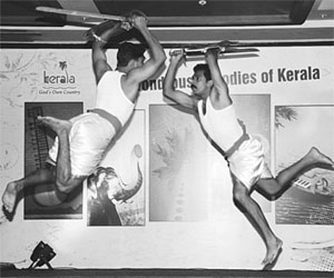 Artistes performing Kalaripayattu