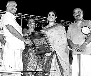Industry Minister Elamaram Kareem presenting a memento to actor Kavya Madhavan at a function held in Kozhikode on Tuesday