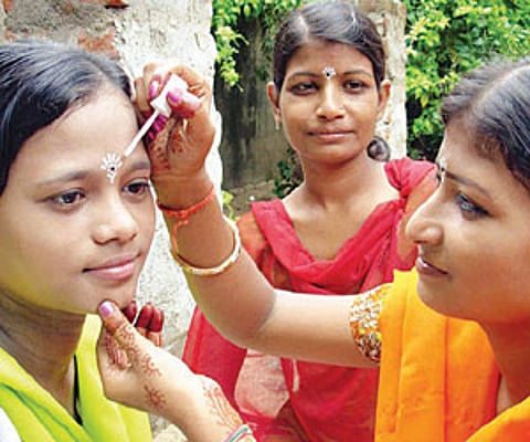 Girls participate in Raja celebrations in Cuttack on Sunday