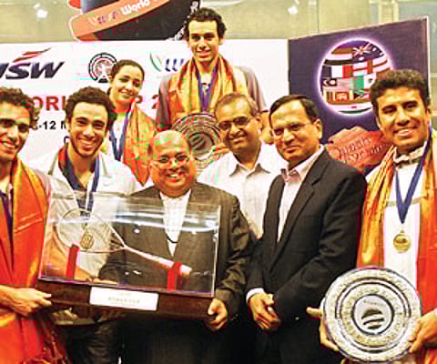The Egyptian squash team with the 2011 World Squash Federation World Cup trophy by in Chennai. (Express Photo)