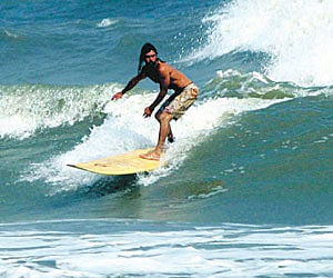 A surfer riding the waves at Ramchandi