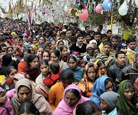 Devotees wait in milling crowds to worship Lord Shiva outside the Aap Shambu temple on the occasion of Mahashivratri in Jammu on Wednesday. (PTI)