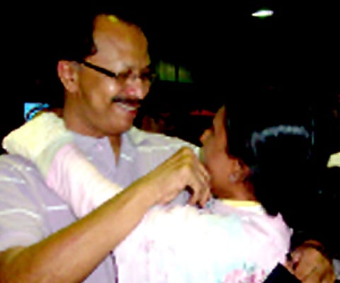 Sabitha hugs her husband Najeeb at the Thiruvananthapuram airport| Express Photo.