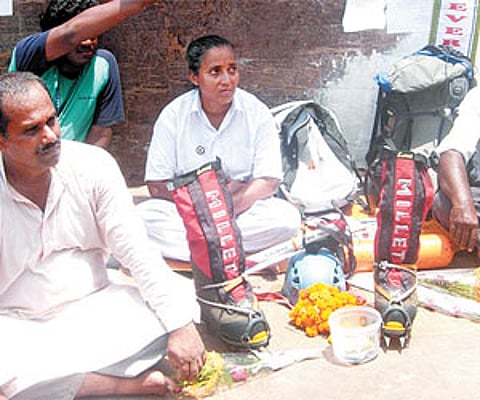 Dash on a silent protest and begging alms (right) in front of Puri’s Jagannath Temple