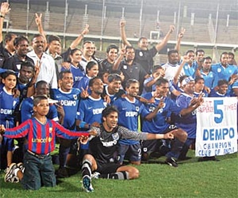 Dempo players celebrate after winning the I-League title