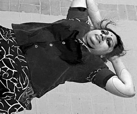 Daisyrani demonstrating asanas at Club Melaange swimming pool in Erode