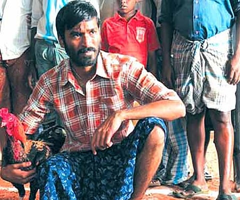 The poster of 'Aadukalam'.