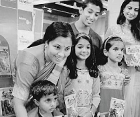 Actors Tara, Deepthi Mohan and Raghuramappa with children at the DVD launch of Chinnu, a 3D animated Kannada rhymes collection | Jithendra M