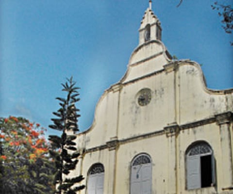 The St Francis CSI Church. (Right) Maintenance work for replacing the wooden panels at the balcony of the church progressing.