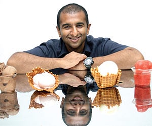 Deepak poses with ice creams in his store Amadora