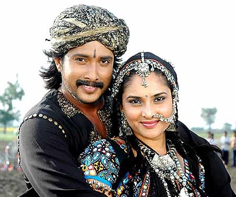 The promotional poster of 'Jothegaara' featuring Prem and Ramya.