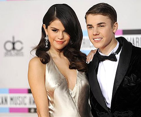Selena Gomez, left, and Justin Bieber (AP Photo/Chris Pizzello).