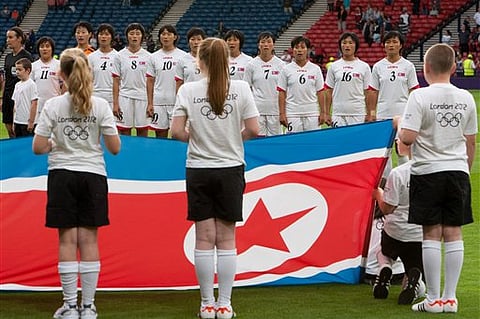 Organizers display South Korea flag instead of North Korea