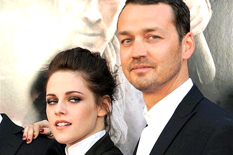 Kristen Stewart and director Rupert Sanders attending the "Snow White and the Huntsman" screening in Los Angeles (Photo by Jordan Strauss/Invision/AP).