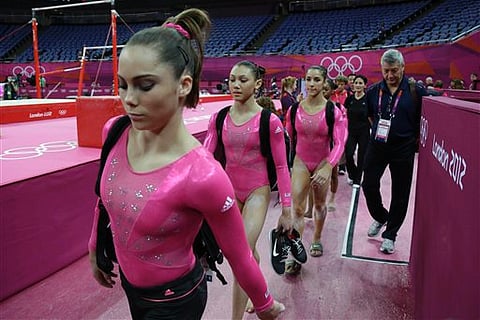 Friend or foe, US gymnasts don't mind who watches