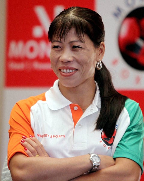 Olympics: Mary Kom punches her way into quarters