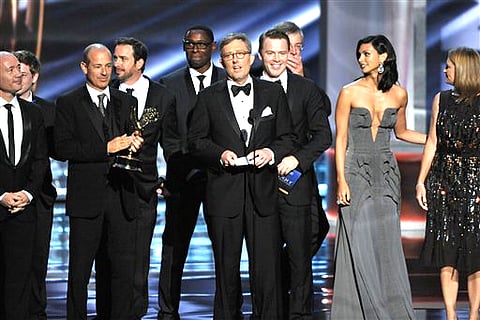 Alex Gansa, center, and the cast and crew of 'Homeland' accept the award for outstanding drama series at the 64th Primetime Emmy Awards at the Nokia Theatre in Los Angeles. (Photo by John Shearer/Invision/AP)